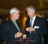 2 executives, men, executive, talking, drinking, drink, hand, photographs, convention, conference, trade show, trade shows, shows, photography, Palm Springs, California, California, photographer, pictures, images, meetings planners, special events, banquets